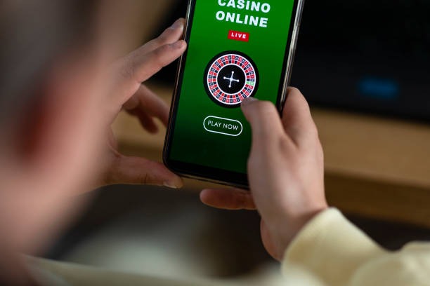 Mobile phone screen showing Treasures Aztec table with betting interface and dealer camera feed